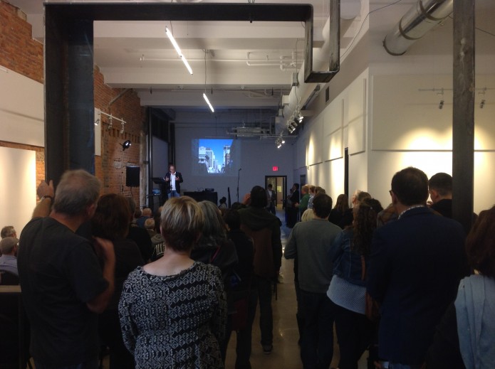 A standing-room-only crowd at the Arts Centre & Lofts listens to seven talks about the link between design and prosperity.